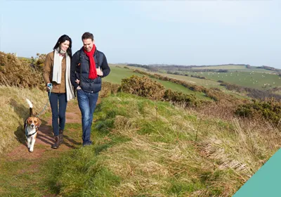 couple walking their dog